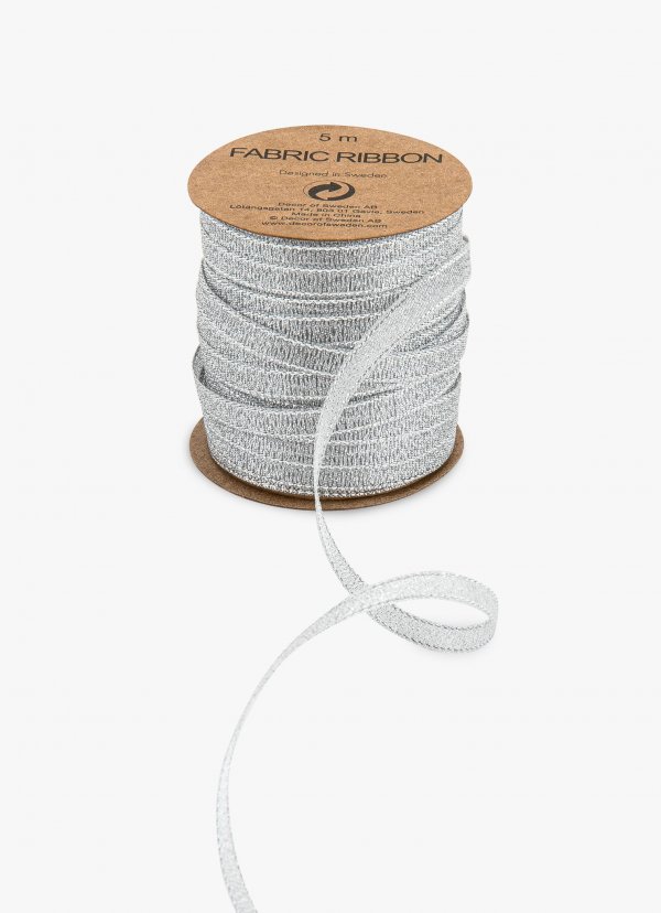 Pakkepael poolil "Hõbedane riidest"